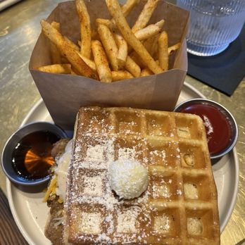The Hideout Kitchen - Waffle sandwich with country fried steak and egg. Seasoned fries on the side - New American Near Me - Lafayette, California The Hideout Kitchen - Waffle sandwich with country fried steak and egg. Seasoned fries on the side - New American Near Me - Lafayette, California
