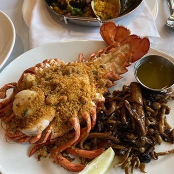 Hemenway's Restaurant - Stuffed lobster w/ shrimp n scallops, side of RI mushrooms. In the back paella. - Seafood Near Me - Providence, Rhode Island Hemenway's Restaurant - Stuffed lobster w/ shrimp n scallops, side of RI mushrooms. In the back paella. - Seafood Near Me - Providence, Rhode Island
