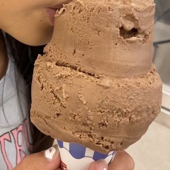 Rite Aid - a woman eating a chocolate ice cream cone - Drugstores Near Me - Manteca, California