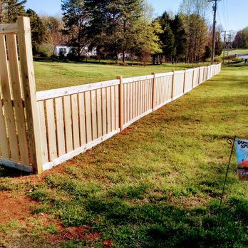 Don The Builder - a wooden fence in a field - Flooring Near Me