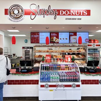 Shipley Do-Nuts - a woman standing in front of a donut shop - Coffee & Tea Near Me - Orlando, Florida Shipley Do-Nuts - a woman standing in front of a donut shop - Coffee & Tea Near Me - Orlando, Florida