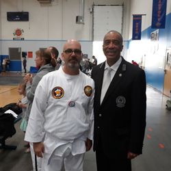 Cover6ix Taekwondo Academy - One of our students with Grand Master Clinton Robinson.