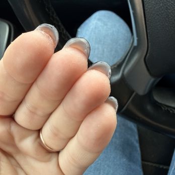 Glo Nail Spa - The unevenness underneath from trying to drill away the underside after the manicure was complete - Nail Salons Near Me - Nipomo, California