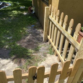 Prideful Services - a wooden picketer and gate - Pressure Washers Near Me - Tampa, Florida
