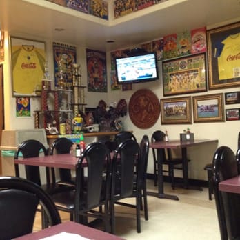 El Rey - Dining room with a tv and soccer jerseys! - Mexican Near Me - Chino, California