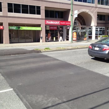 Pharmasave - a car driving down a city street - Drugstores Near Me - Vancouver, British Columbia Pharmasave - a car driving down a city street - Drugstores Near Me - Vancouver, British Columbia