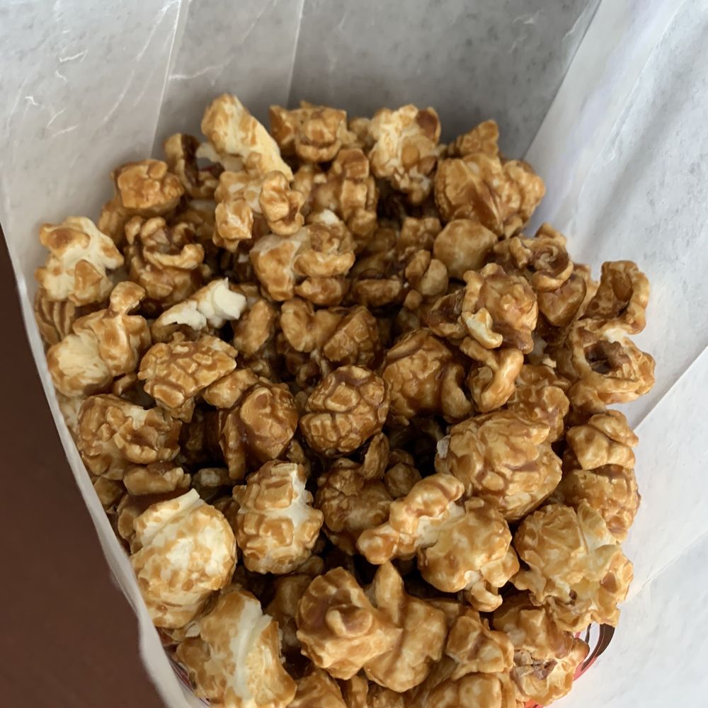 Fancypants Popcorn - a white paper bag filled with caramel popcorn - Popcorn Shops Near Me - Pittsburgh, Pennsylvania