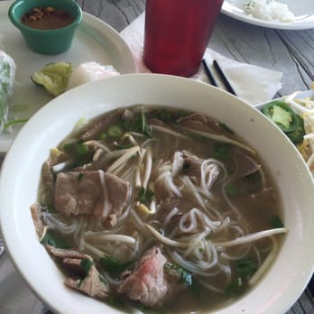 Pho Binh Heights - Steak & Brisket Rice Noodle soup w/Spring Rolls. The broth was outstanding! Squeeze of lime, cilantro, Thai basil & bean sprouts. Yum!!! - Vietnamese Near Me - Houston, Texas
