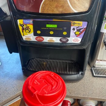 Pilot Travel Center - a person holding a cup of coffee in front of a vending machine - Gas Stations Near Me - San Antonio, Texas Pilot Travel Center - a person holding a cup of coffee in front of a vending machine - Gas Stations Near Me - San Antonio, Texas