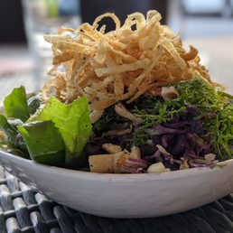 a bowl of salad on a table