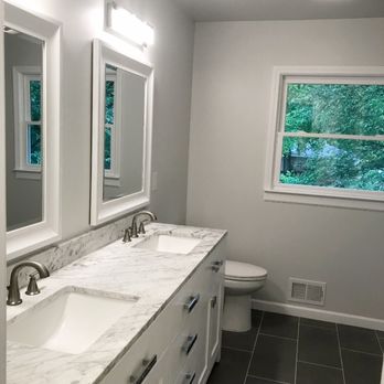 Clever Home - a bathroom with two sinks and a toilet - General Contractors Near Me - Marietta, Georgia
