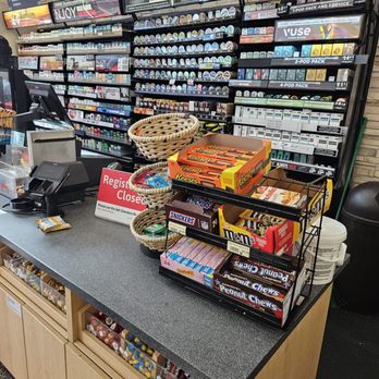 Wawa - a store counter with a variety of snacks - Gas Stations Near Me - Orlando, Florida