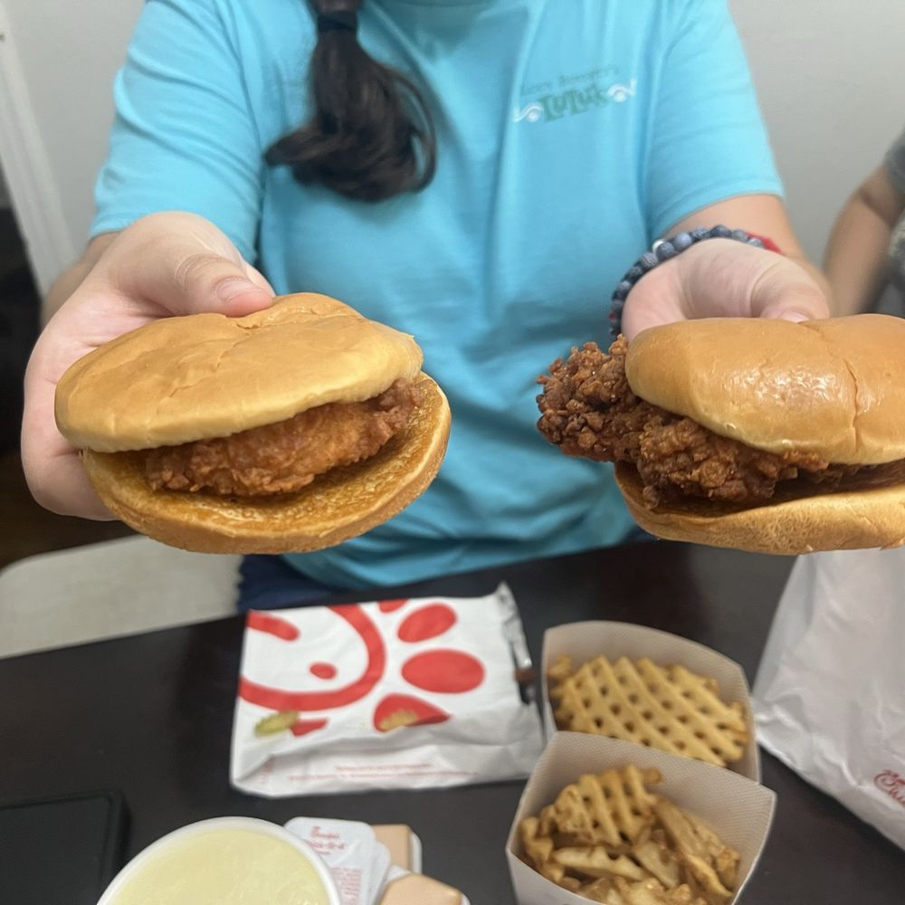 Originally Chicken sandwich with a small tender on the left and Spicy Chicken Sandwich with regular chicken breast