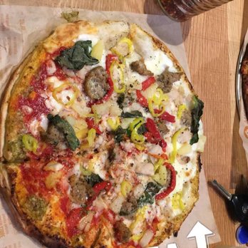Blaze Pizza - High rise half spicy sauce half white sauce with pesto garlic on the crust - Salad Near Me - Reno, Nevada