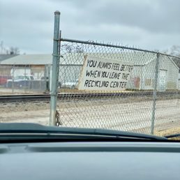 Muddy road with adjacent train tracks when leaving. The sign says it all. Muddy road with adjacent train tracks when leaving. The sign says it all.