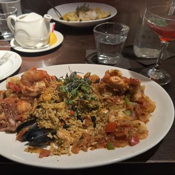 BLVD Kitchen & Bar - Jambalaya with tons of seafood and a nice amount of spice. Very tasty and refreshing Blackberry and Basil Mocktini. - American Near Me - Minnetonka, Minnesota
