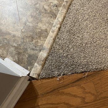 America Flooring Systems - Improper measurement for one transitional strip; carpet fraying. The strip that was put down for the tile is lifting. - Flooring Near Me - Stockbridge, Georgia