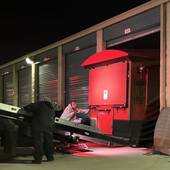 DLT Transport - Kiosk safely going into the storage unit - Towing Near Me