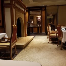 a dining room with a fireplace a dining room with a fireplace