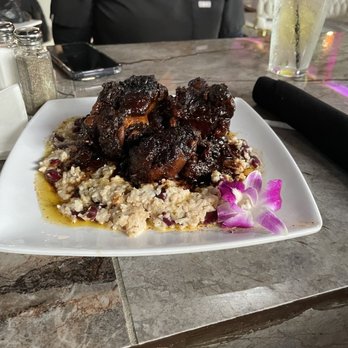 Cache 42 Kitchen & Cocktails - Oxtails with rice; love the presentation... - Cocktail Bars Near Me - Memphis, Tennessee Cache 42 Kitchen & Cocktails - Oxtails with rice; love the presentation... - Cocktail Bars Near Me - Memphis, Tennessee