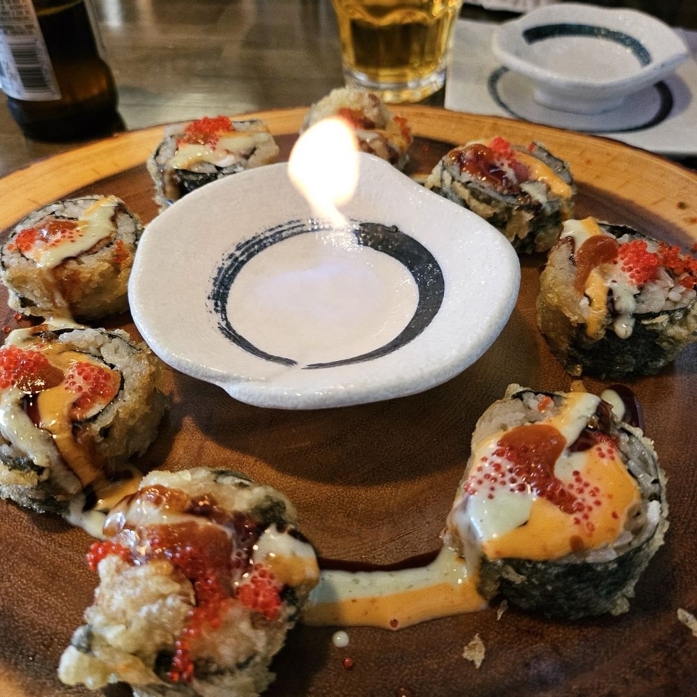 Hashi Gawa - Sparkling Rainbow rolls with fire in the middle for atmosphere. - Japanese Near Me - Alameda, California