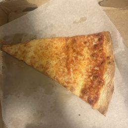Pizza by the slice-- $4.50. The portion is ridiculous!