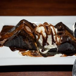 Boscos Restaurant & Brewing Company - Warm Brownie with soft cream cheese à la mode.