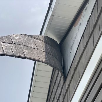Legacy Homes - Architectural "shake siding" blew loose in relatively mild 20-25 mph winds on June 17, 2021. - Home Developers Near Me - La Vista, Nebraska