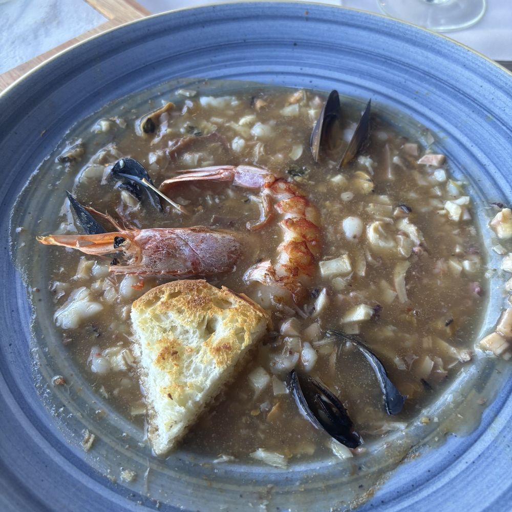Puerto Cristal - Their master recipes of seafood soup. I should've just had this. It is very filling so many kinds of seafood in the soup. - Seafood Near Me - Buenos Aires, C