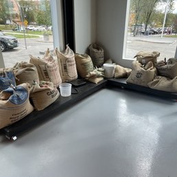 bags of coffee on a bench in a coffee shop bags of coffee on a bench in a coffee shop