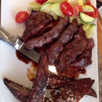 Chill Kitchen & Bar - Flat iron steak with garlicky veggie medley, steak fries/potato wedges, & steak sauce - Desserts Near Me - Marlborough, Massachusetts