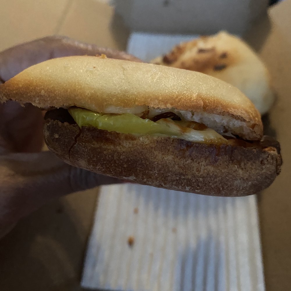 Domino's Pizza - a hand holding a sandwich - Pizza Near Me - Frisco, Texas Domino's Pizza - a hand holding a sandwich - Pizza Near Me - Frisco, Texas