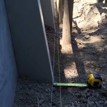 Pleasure Pools & Spas - The supports should have been set to the yellow string. Over a 12 foot run, it's off by 2 inches! - Hot Tub & Pool Near Me - Davenport, Iowa Pleasure Pools & Spas - The supports should have been set to the yellow string. Over a 12 foot run, it's off by 2 inches! - Hot Tub & Pool Near Me - Davenport, Iowa