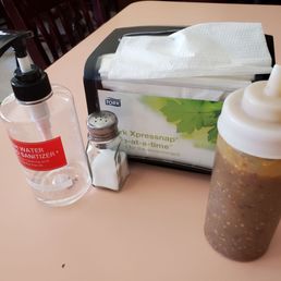 Photo of Tacos Moreno - Santa Cruz, CA, United States. Santa Cruz rona fearful table setup... Heads up... Hand sanitizer won't stop rona. And please wash your hands with soap and water. :)