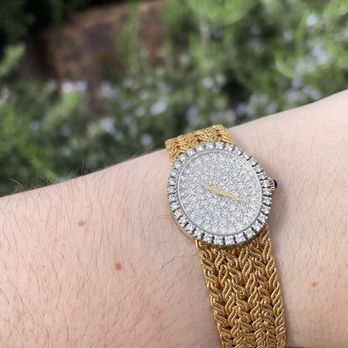 MacTavish Jewelers - Exquisite Baume & Mercier 18K solid gold watch with 2 carats of pave diamonds on the bezel and dial and features a sapphire on the dial. - Jewelry Near Me - Irvine, California MacTavish Jewelers - Exquisite Baume & Mercier 18K solid gold watch with 2 carats of pave diamonds on the bezel and dial and features a sapphire on the dial. - Jewelry Near Me - Irvine, California