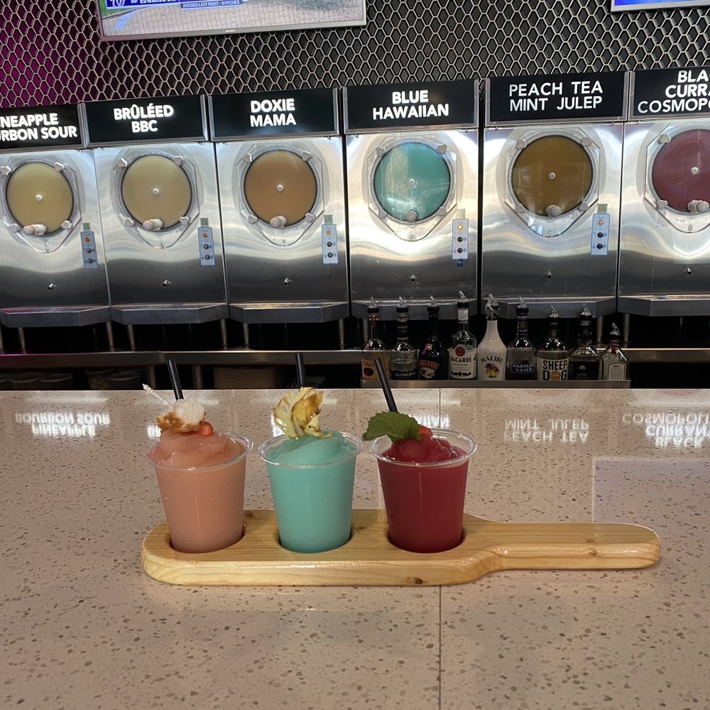 Doxie Slush - Flight (L to R): Strawberry Amaretto Shortcake, Blue Hawaiian, Strawberry Hibiscus Frose - Seafood Near Me - Hermann, Missouri Doxie Slush - Flight (L to R): Strawberry Amaretto Shortcake, Blue Hawaiian, Strawberry Hibiscus Frose - Seafood Near Me - Hermann, Missouri