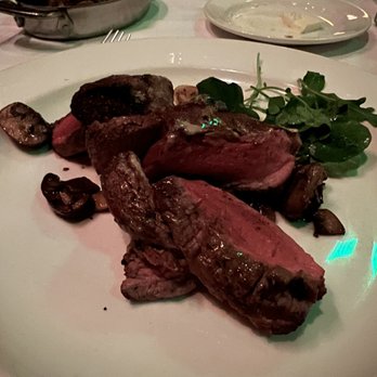 The Capital Grille - Sliced Filet Mignon with Cipollini Onions, Wild Mushrooms and Fig Essence - Steakhouses Near Me - Memphis, Tennessee The Capital Grille - Sliced Filet Mignon with Cipollini Onions, Wild Mushrooms and Fig Essence - Steakhouses Near Me - Memphis, Tennessee