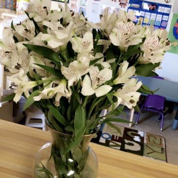Safeway - a vase of white flowers on a table - Grocery Near Me - Fairbanks, Alaska