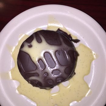 OHMS Cafe And Bar - Flourless Chocolate Tart. Semi sweet dense chocolate dessert - delish! - Cafes Near Me - Amarillo, Texas OHMS Cafe And Bar - Flourless Chocolate Tart. Semi sweet dense chocolate dessert - delish! - Cafes Near Me - Amarillo, Texas