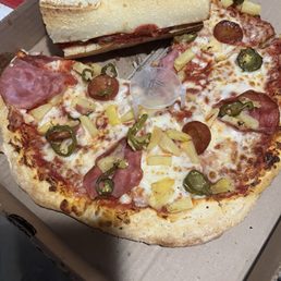 Spicy Hawaiian luau pizza and sausage and beef sandwich Spicy Hawaiian luau pizza and sausage and beef sandwich