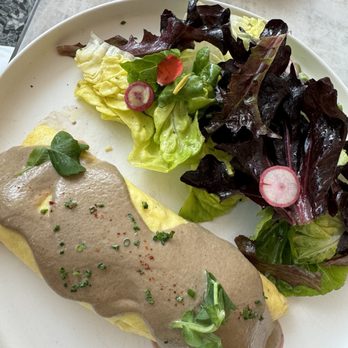 Le Jardinier - French omelette, sautéed greens, gruyere, morel crème - French Near Me - Houston, Texas Le Jardinier - French omelette, sautéed greens, gruyere, morel crème - French Near Me - Houston, Texas