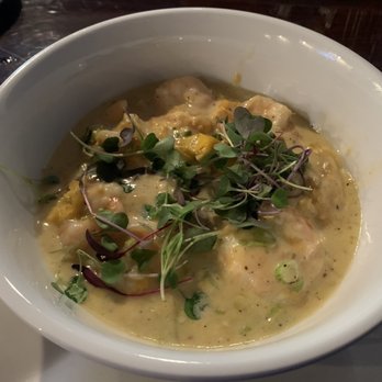 4118 Kitchen+Bar - Shrimp and grits with andouille sausage, garlic cream, and yellow tomatoes - New American Near Me - Highlands, North Carolina 4118 Kitchen+Bar - Shrimp and grits with andouille sausage, garlic cream, and yellow tomatoes - New American Near Me - Highlands, North Carolina