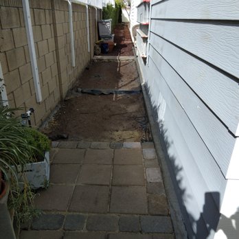 Biltright Turf - Back yard behind coach was all lava rock.  Wanted path to BBQ - Landscaping Near Me