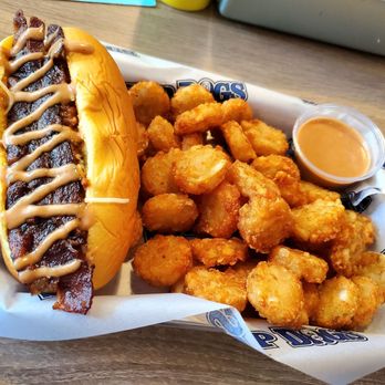 Sup Dogs - Smokehouse Dog; bacon, Monterey jack, cheddar, chili, Sup Dog sauce. Side of tots and Sup Dog sauce - New American Near Me - Chapel Hill, North Carolina Sup Dogs - Smokehouse Dog; bacon, Monterey jack, cheddar, chili, Sup Dog sauce. Side of tots and Sup Dog sauce - New American Near Me - Chapel Hill, North Carolina