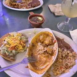 La Posada Mexican Restaurant - Pork tamales with puff beef taco, rice and beans.