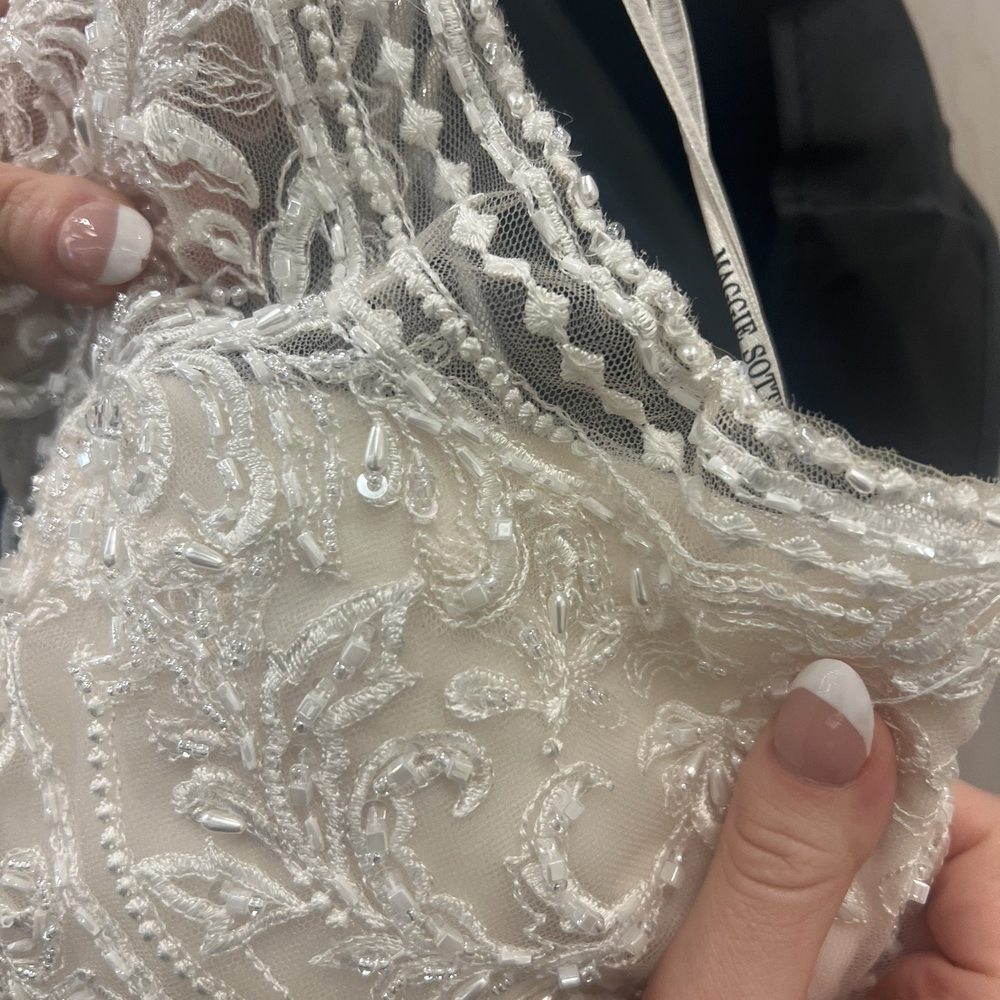 Ten Bridal - The beads were just pulled together to "fit" it changed the integrity of the dress - Bridal Near Me - Henderson, Nevada