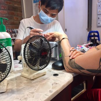 Season Spa - Mr. Raymond working his magic on his client. Ask for Raymond if you want perfect nails! - Massage Near Me - New York, New York Season Spa - Mr. Raymond working his magic on his client. Ask for Raymond if you want perfect nails! - Massage Near Me - New York, New York