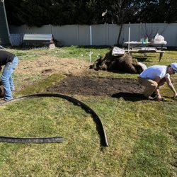 Stirling Landscaping - Crew working hard installing sod!