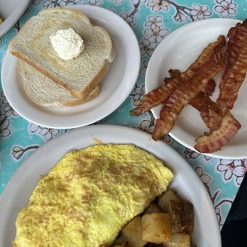 The Omelettry - House special omelette with home fries, sourdough toast and bacon. - American Near Me - Austin, Texas The Omelettry - House special omelette with home fries, sourdough toast and bacon. - American Near Me - Austin, Texas