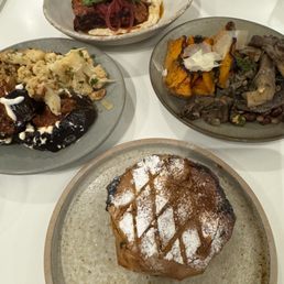 Chicken Pastilla (bottom), cauliflower and aubergine (left), Lamb Kofta (top), mushrooms and butternut squash (right) Chicken Pastilla (bottom), cauliflower and aubergine (left), Lamb Kofta (top), mushrooms and butternut squash (right)